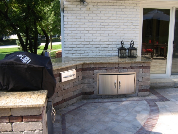 Outdoor Kitchen Area with Granite Countertop